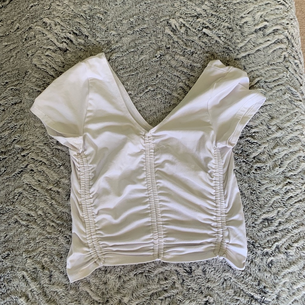 Low cut white rouged baby tee.